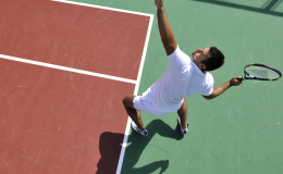 young man play tennis outdoor