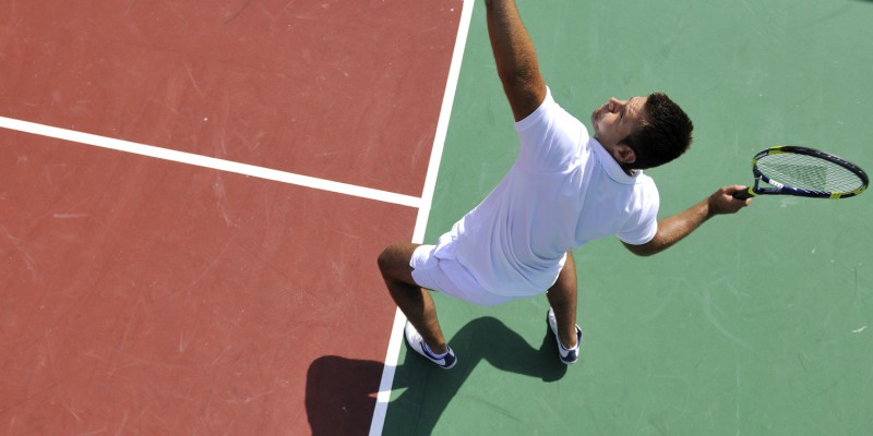 young man play tennis outdoor